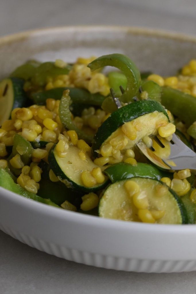 This easy old-fashioned zucchini and corn skillet is a quick 10-minute side dish made with garden zucchini, sweet corn, and peppers.