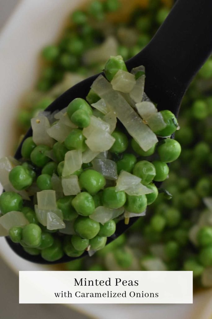 close up of a spoon with minted peas and onions
