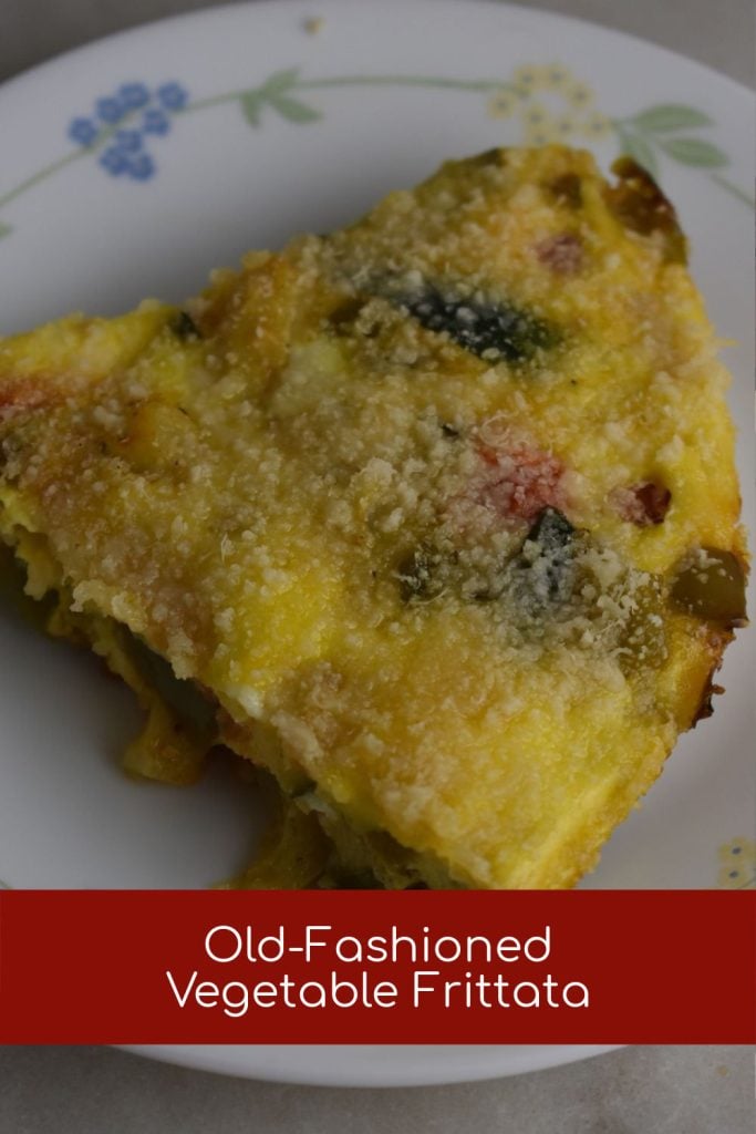 Slice of Oven Skillet Frittata with eggs, vegetables and parmesan cheese